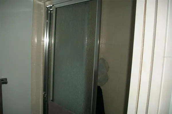 a view of walk in closet with clothes