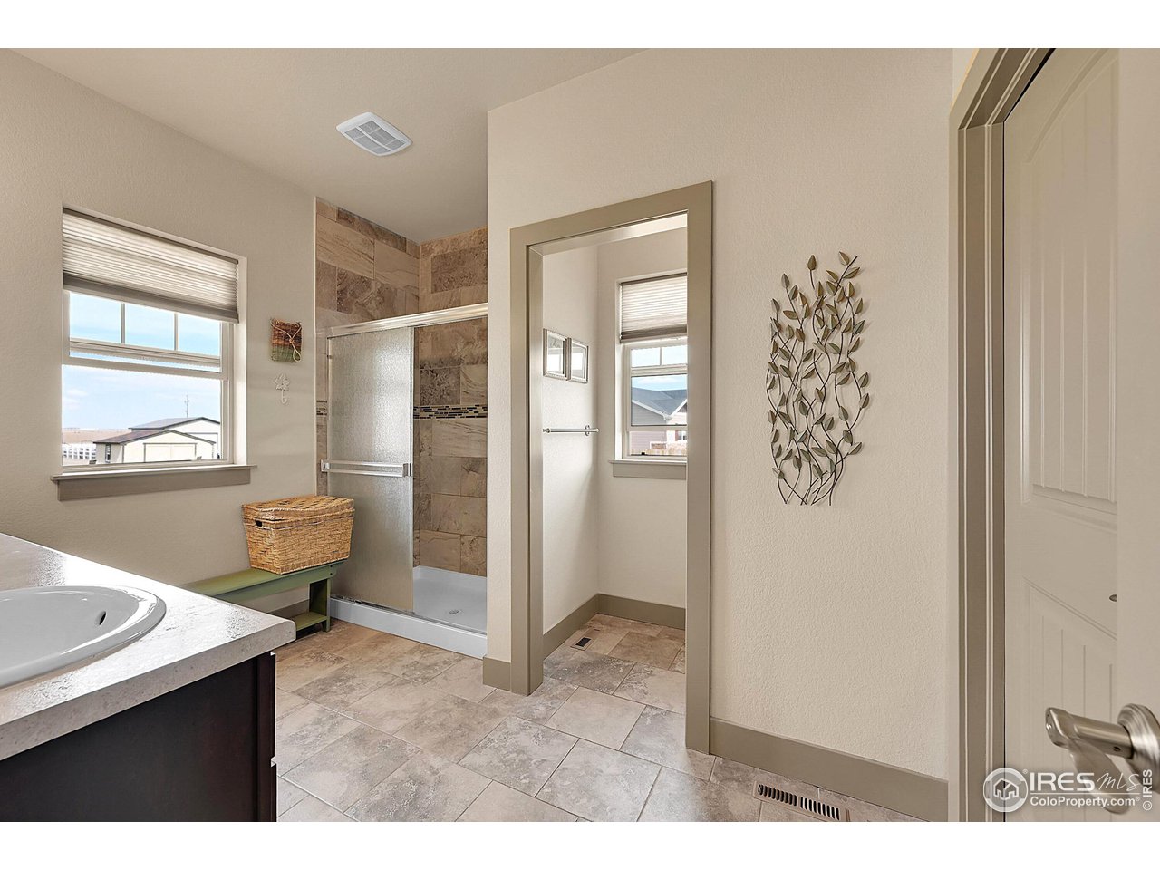 40775 Jade Drive Ault, CO 80610 - Photo 18 of 40 a kitchen with a refrigerator and a sink