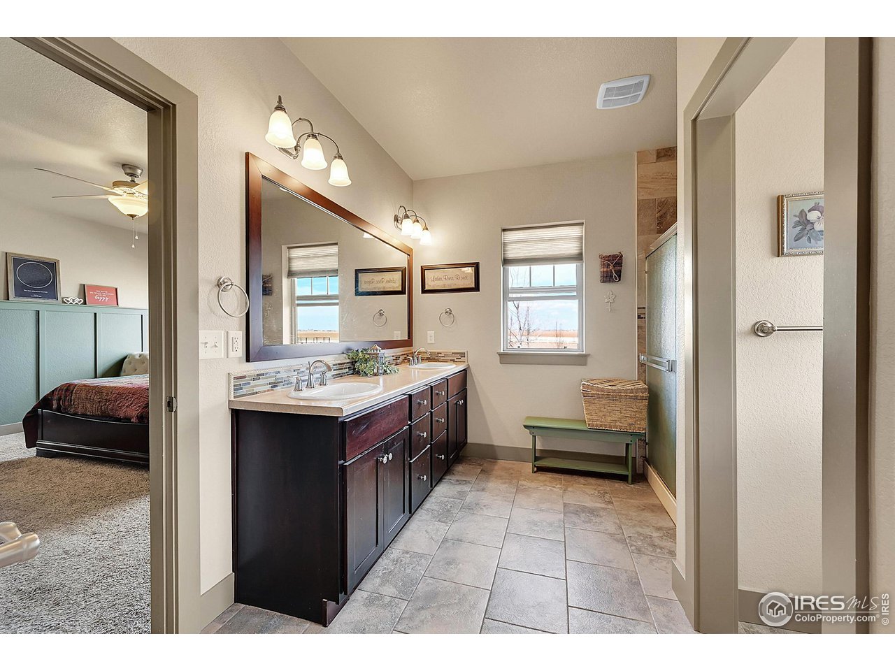 40775 Jade Drive Ault, CO 80610 - Photo 19 of 40 a kitchen with a refrigerator and a sink