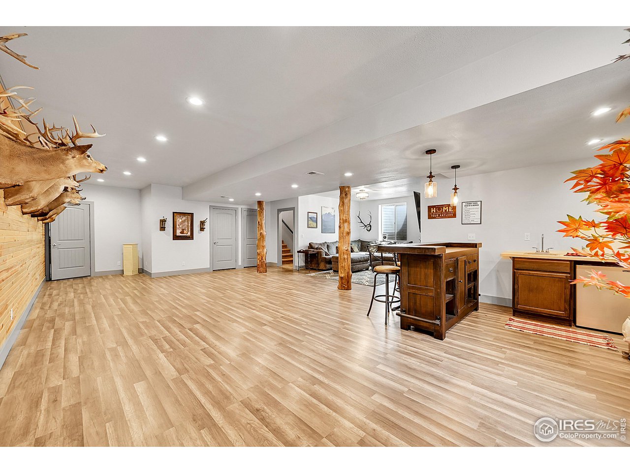 40775 Jade Drive Ault, CO 80610 - Photo 22 of 40 a living room with furniture and a wooden floor