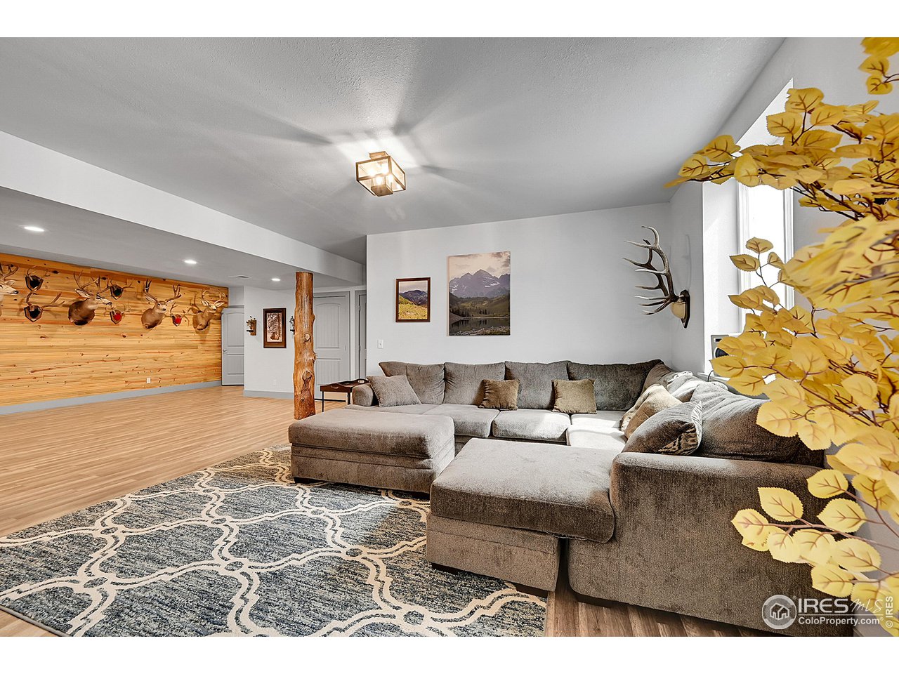40775 Jade Drive Ault, CO 80610 - Photo 26 of 40 a living room with furniture and a large window