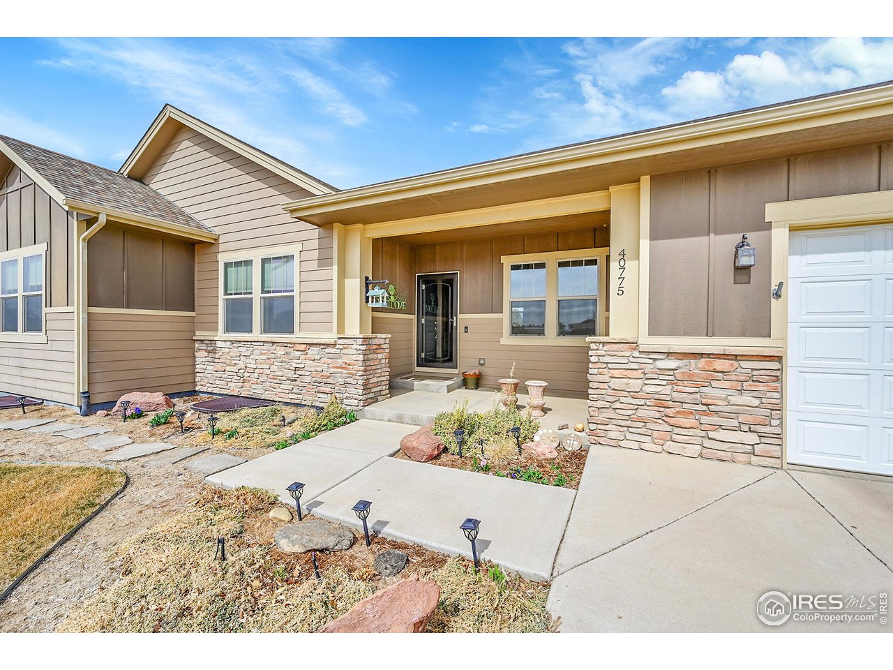 40775 Jade Drive Ault, CO 80610 - Photo 3 of 40 a view of a house with wooden floor