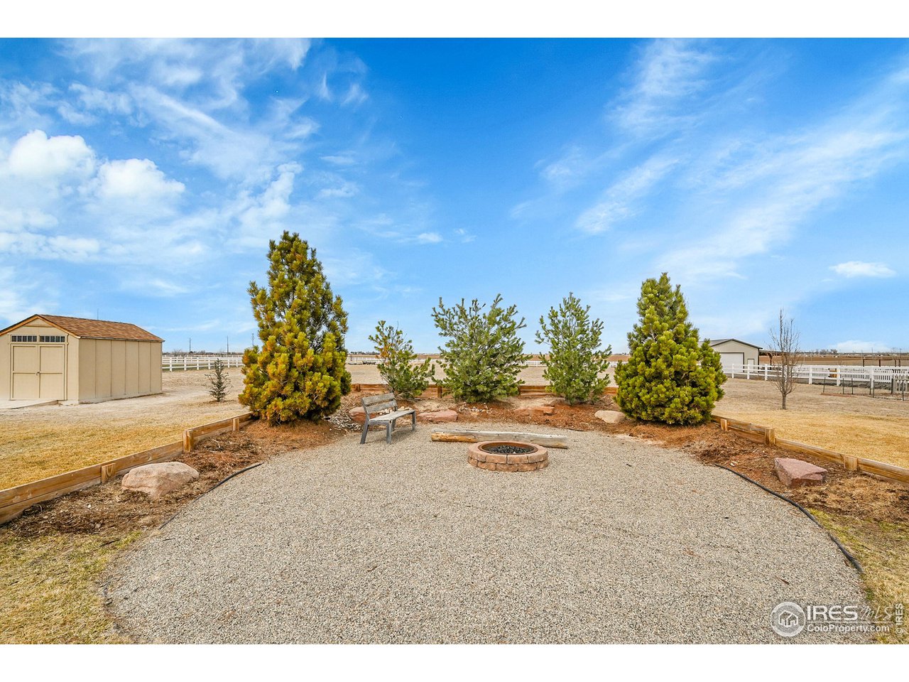 40775 Jade Drive Ault, CO 80610 - Photo 31 of 40 a view of a dirt road with a building in the background