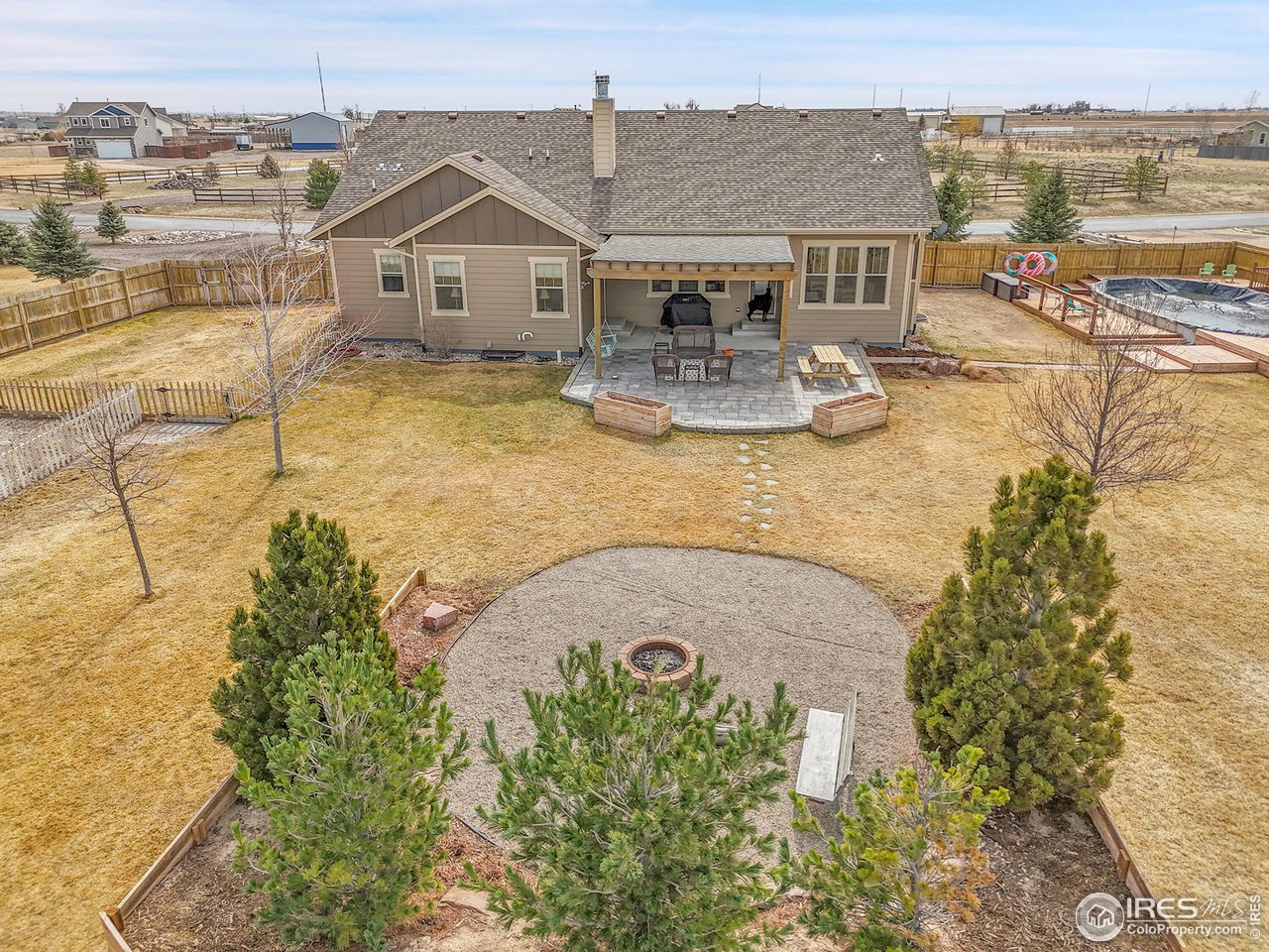 40775 Jade Drive Ault, CO 80610 - Photo 33 of 40 an aerial view of a house with swimming pool and ocean view