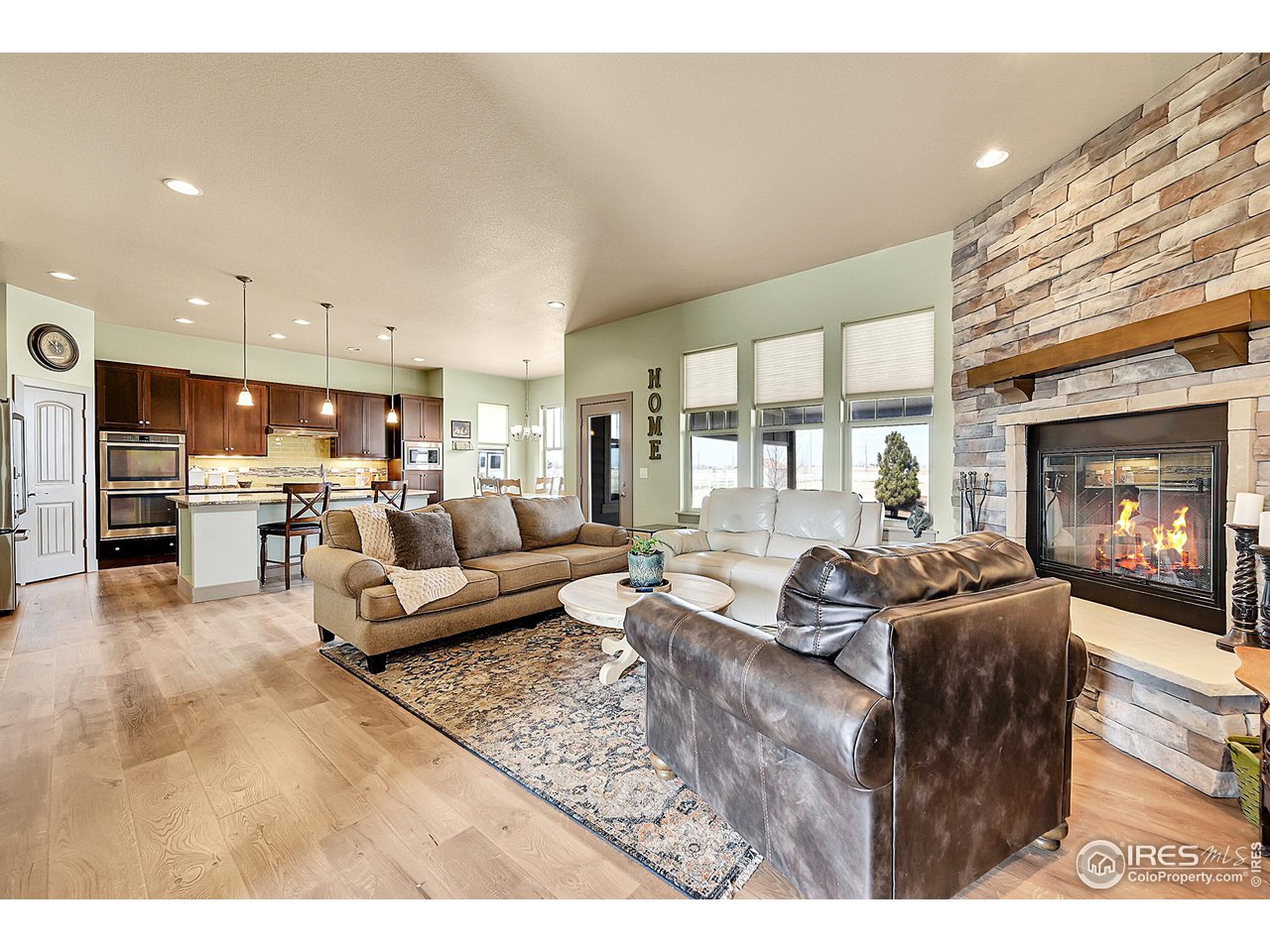 40775 Jade Drive Ault, CO 80610 - Photo 5 of 40 a living room with furniture and a fireplace