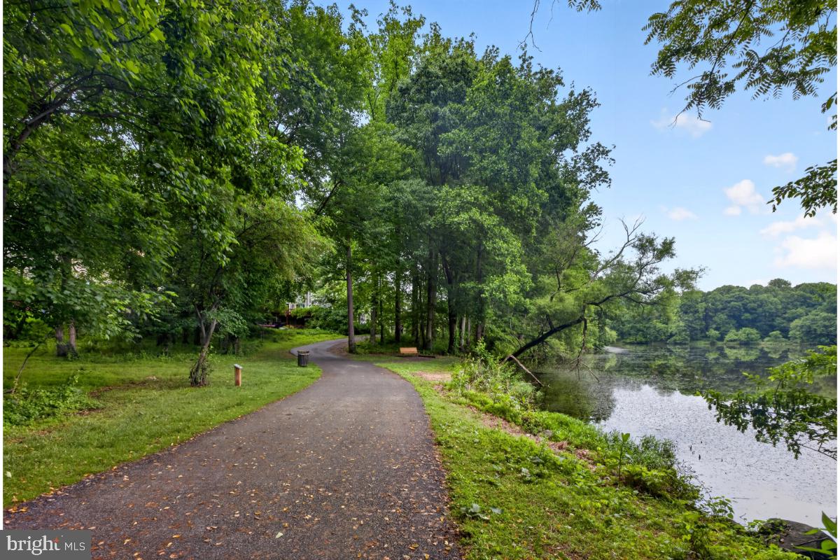 7347 Swan Point Way, Unit 122 Columbia, MD 21045 - Photo 48 of 54 a view of a lake with a yard