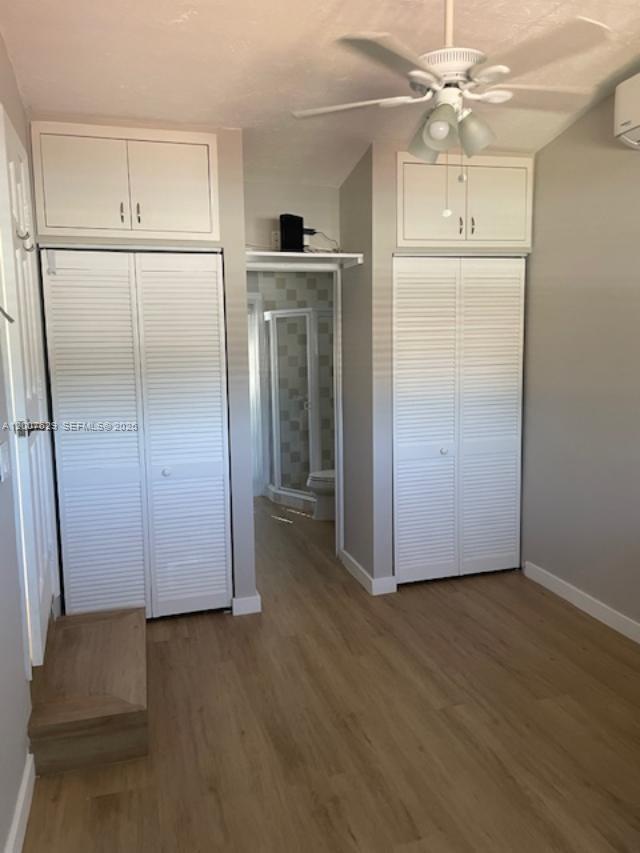 5886 Southwest 42nd Street Miami, FL 33155 - Photo 13 of 20 a view of kitchen with wooden floor electronic appliances and cabinets