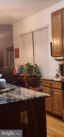 a kitchen with a sink and wooden cabinets