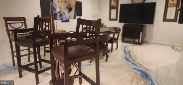 a kitchen with a table and chairs in it