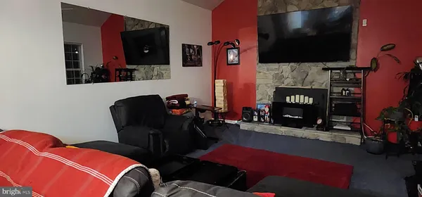 a room with furniture and a flat screen tv