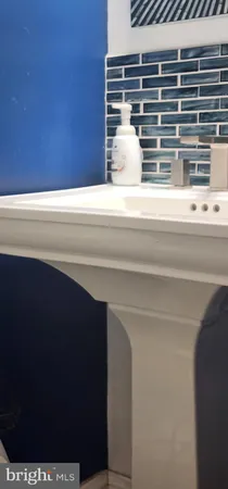 a bedroom with furniture and a chair