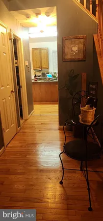 a view of a dinning table and chairs in the kitchen