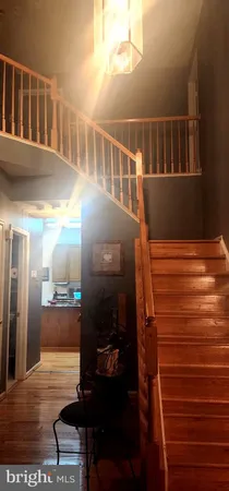 a room with water heater and wooden floor