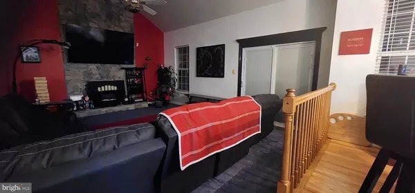 a bedroom with furniture and a fireplace