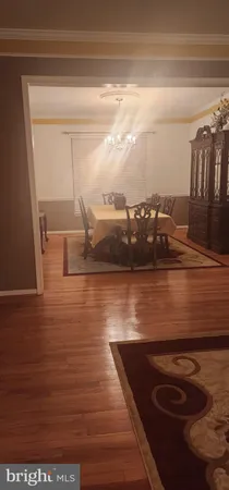 a bedroom with a bed and mirror