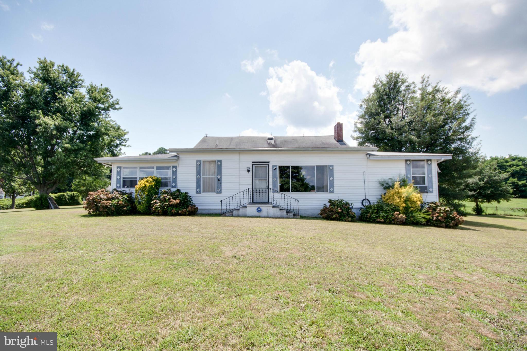 38130 Graves Road Coltons Point, MD 20626 - Photo 2 of 30 a front view of a house with a garden and trees