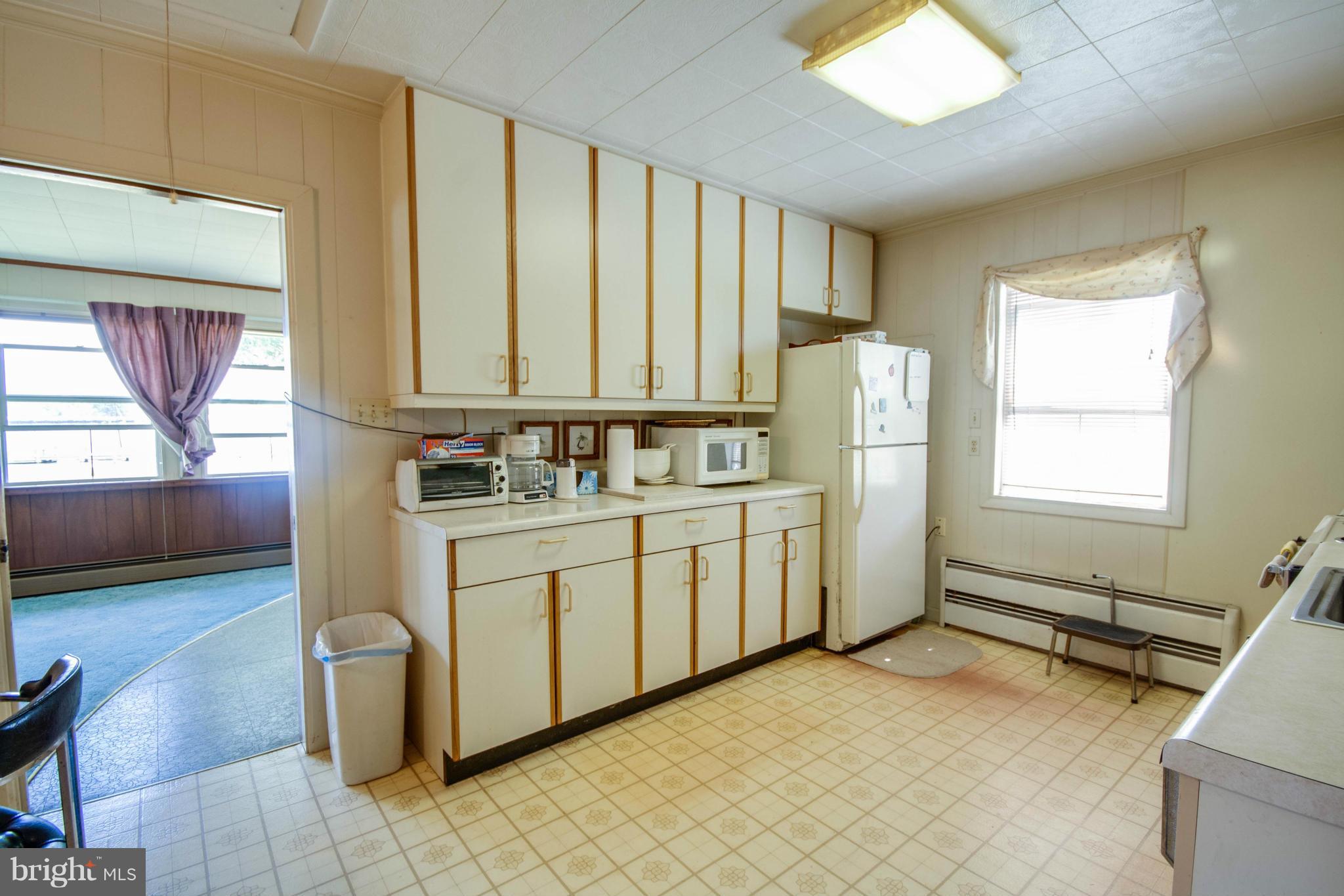 38130 Graves Road Coltons Point, MD 20626 - Photo 14 of 30 a kitchen with appliances cabinets and a table