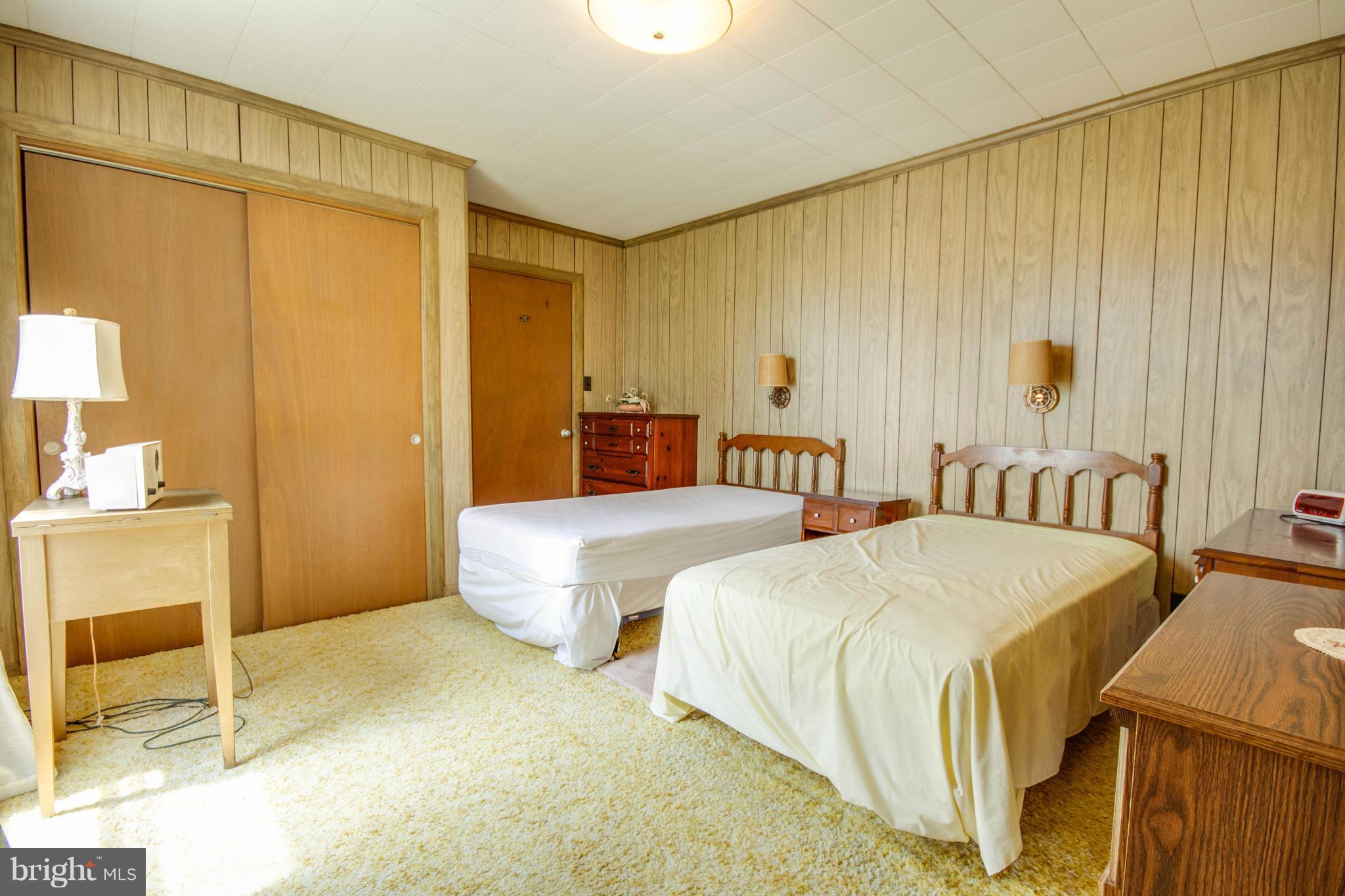 38130 Graves Road Coltons Point, MD 20626 - Photo 15 of 30 a spacious bedroom with two beds and a table
