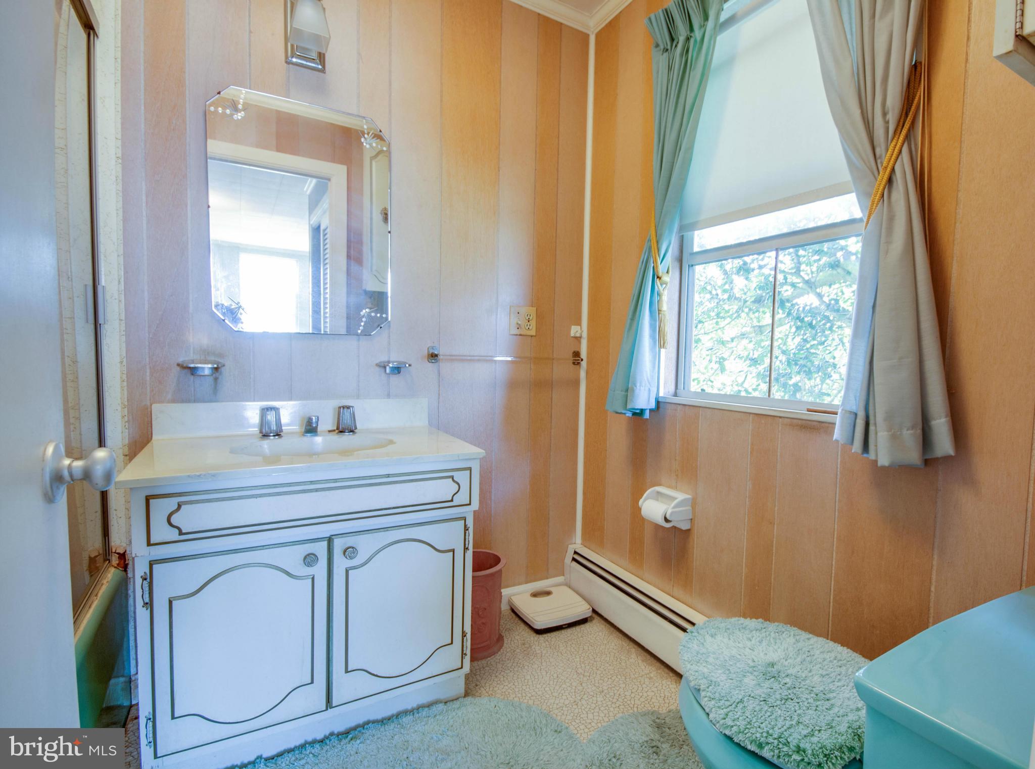 38130 Graves Road Coltons Point, MD 20626 - Photo 17 of 30 a bathroom with a granite countertop sink a toilet and a mirror