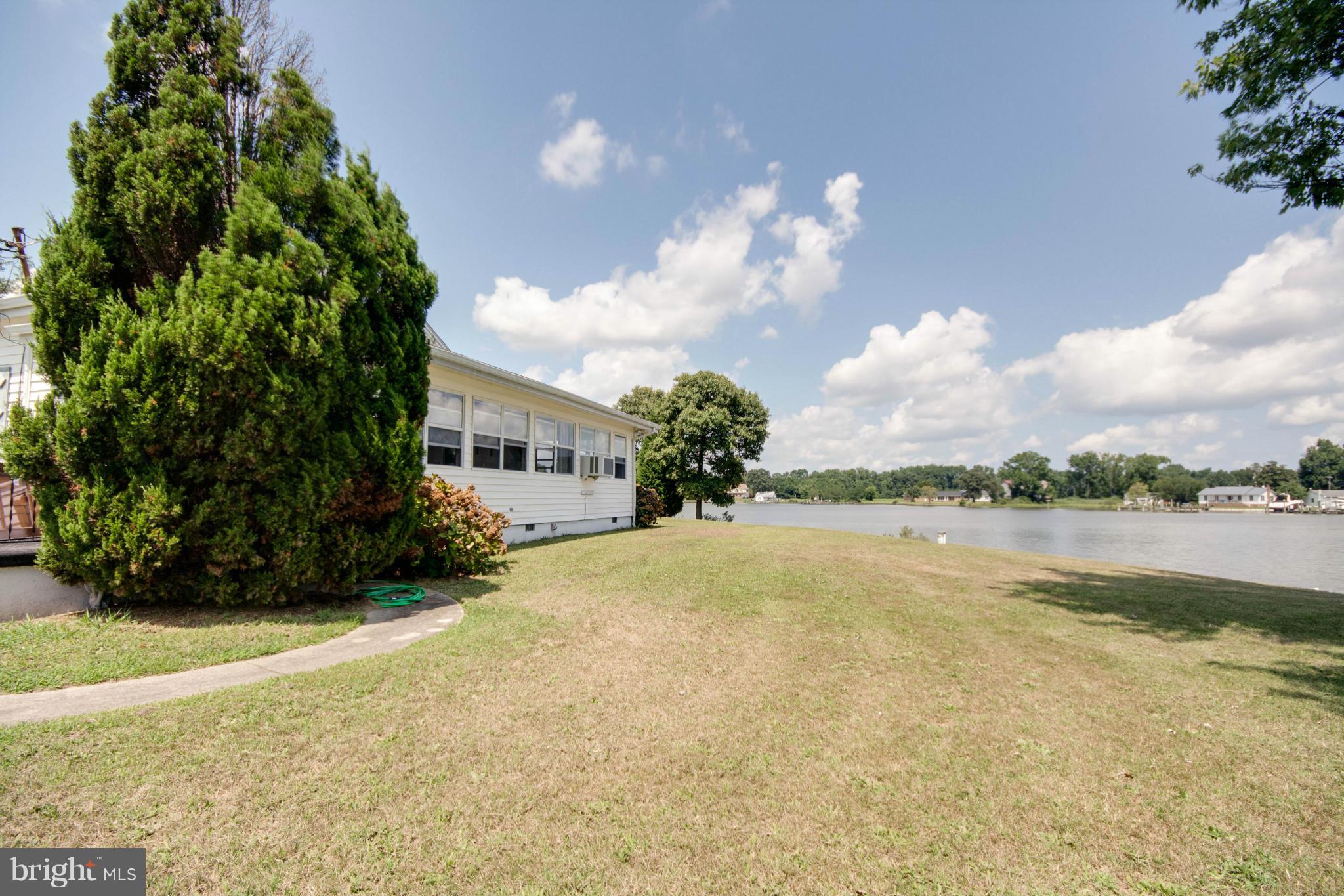 38130 Graves Road Coltons Point, MD 20626 - Photo 21 of 30 a front view of a house with a yard and a large tree