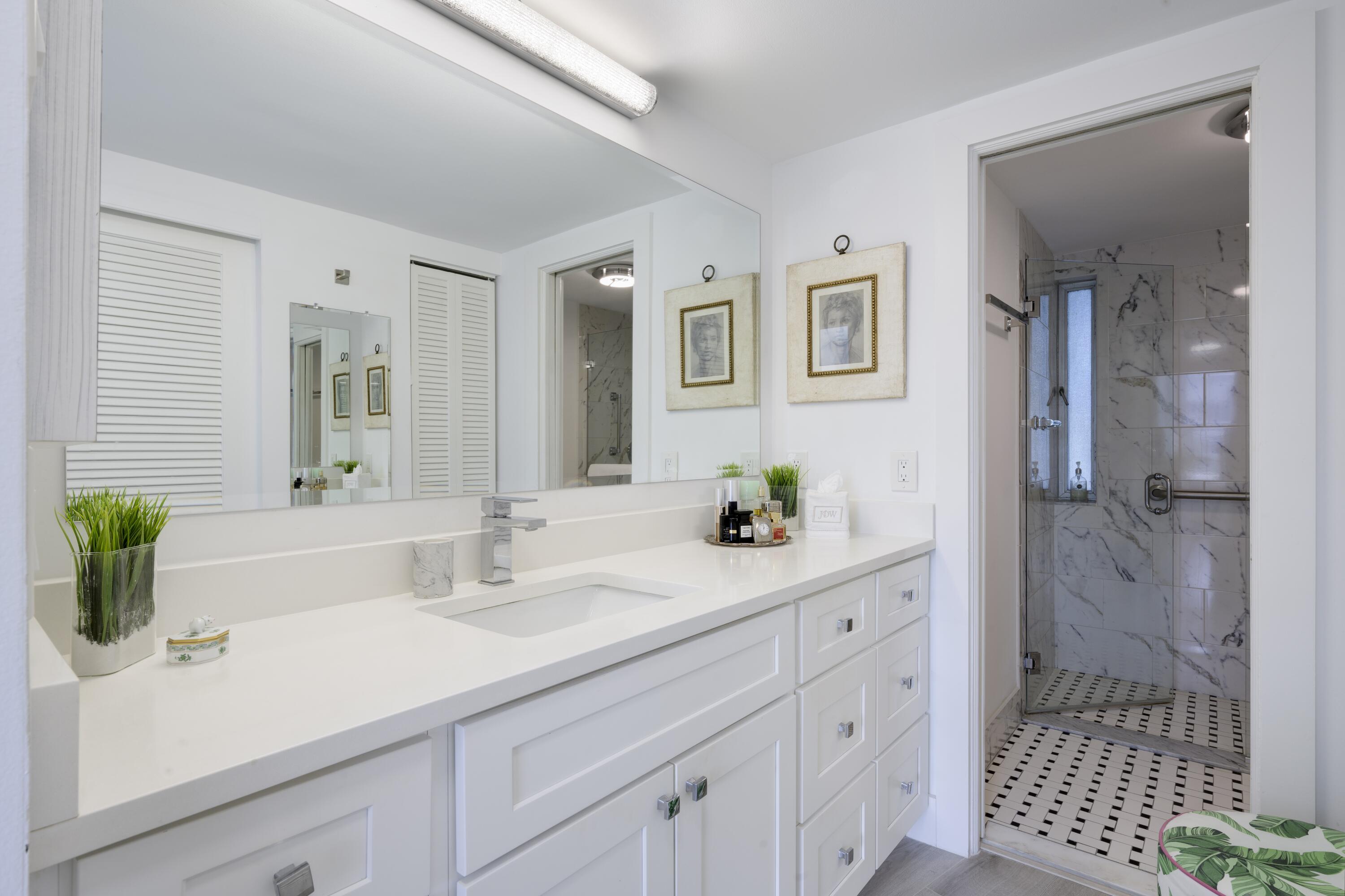 2760 South Ocean Boulevard, Unit 213 Palm Beach, FL 33480 - Photo 11 of 24 a bathroom with a sink and a mirror