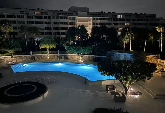 a view of a swimming pool and an outdoor space