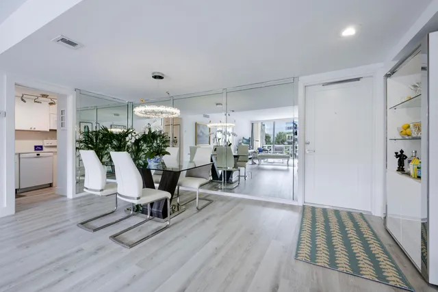 a view of a dining room with furniture and a window