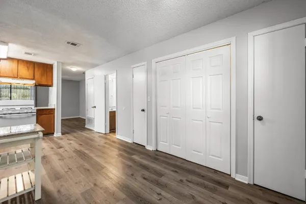 a bedroom with a bed and a view of bathroom