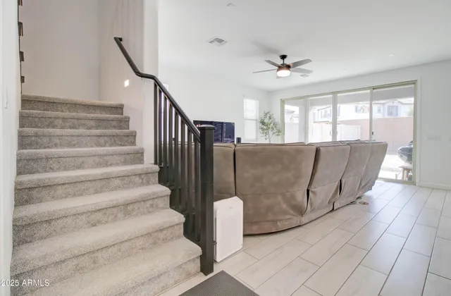a view of a bedroom with furniture and windows