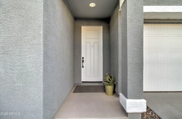 a view of a hallway with couch and a window
