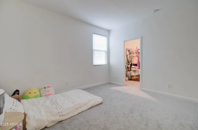a view of a roof deck with couches chairs and wooden floor