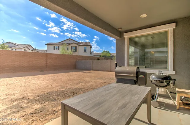 a view of a swimming pool with an outdoor seating