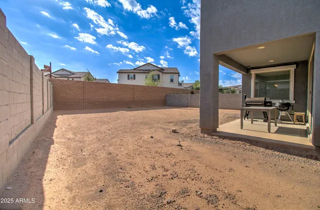 an aerial view of a chairs and table on the terrace