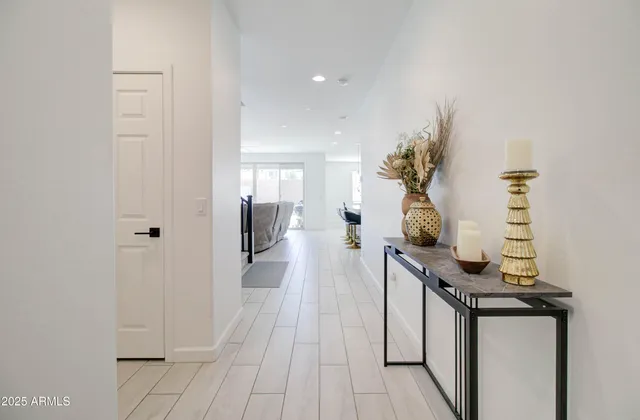 a view of a hallway with seating area