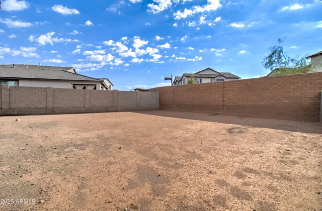a view of a chairs and tables in a patio