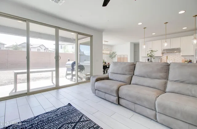 a kitchen with cabinets table and chairs