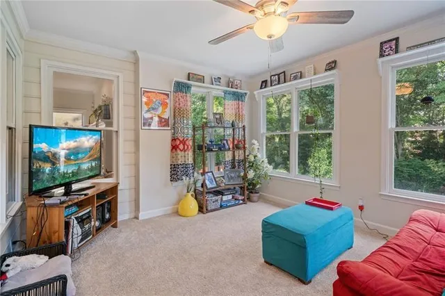 a spacious bedroom with a bed and a chandelier
