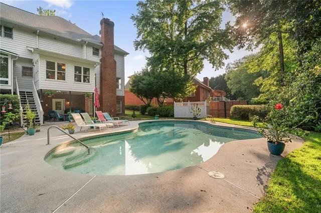 a view of a swimming pool with lounge chair