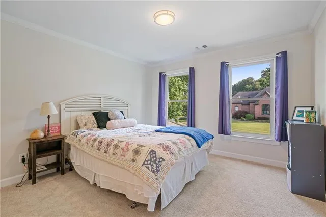 an aerial view of a house with a yard basket ball court
