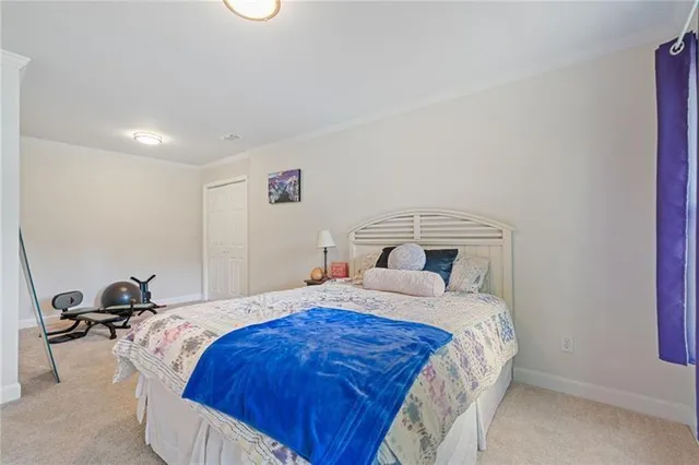 an aerial view of a house with a yard basket ball court and outdoor seating