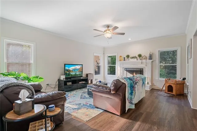 a living room with furniture and a fireplace