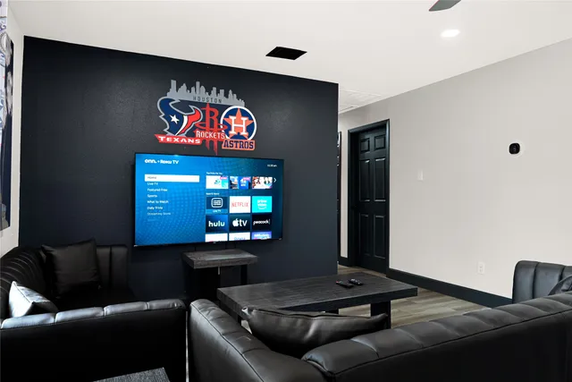 a room with pool table and windows