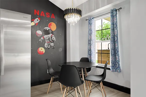 a kitchen with sink and a mirror