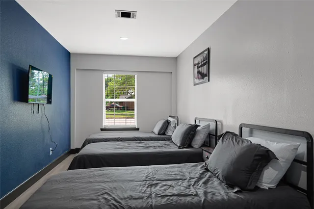 a view of a kitchen with furniture and a potted plant