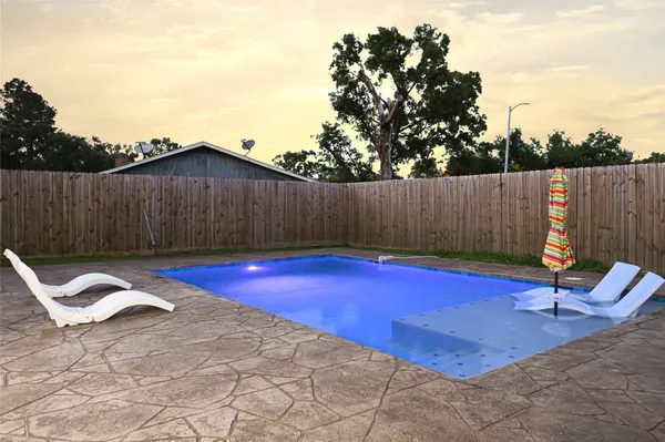 a view of a house with swimming pool