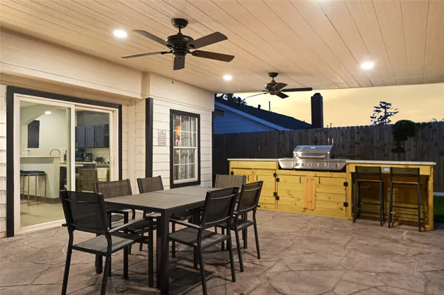 a view of a backyard with swimming pool