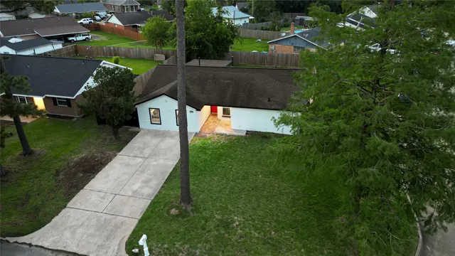 a view of yard from deck with patio