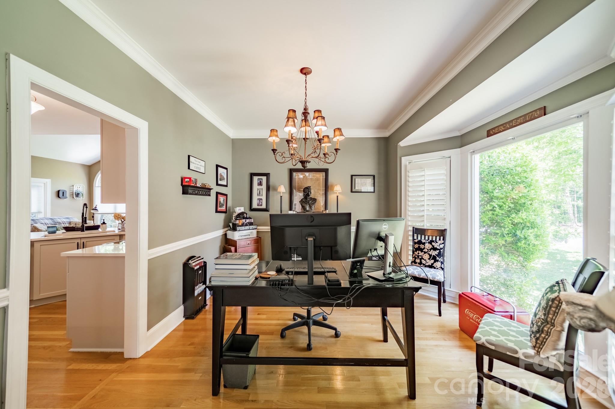 11043 Seven Coves Drive Tega Cay, SC 29708 - Photo 16 of 45 a view of a dining room with furniture window and outside view