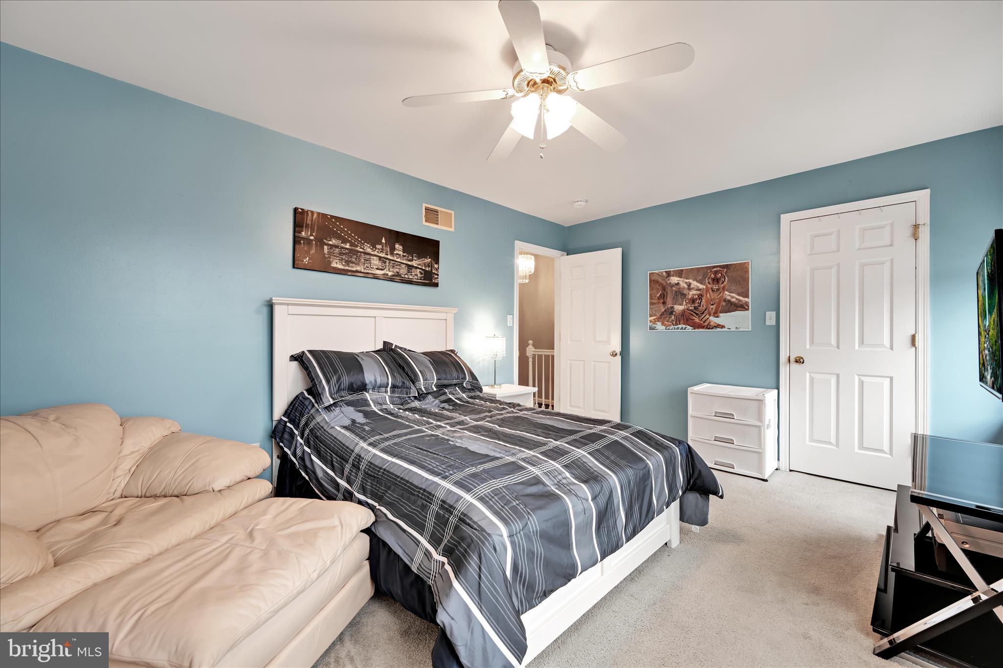 160 Riders Way Lebanon, PA 17042 - Photo 21 of 29 a bedroom with a large bed and a chandelier