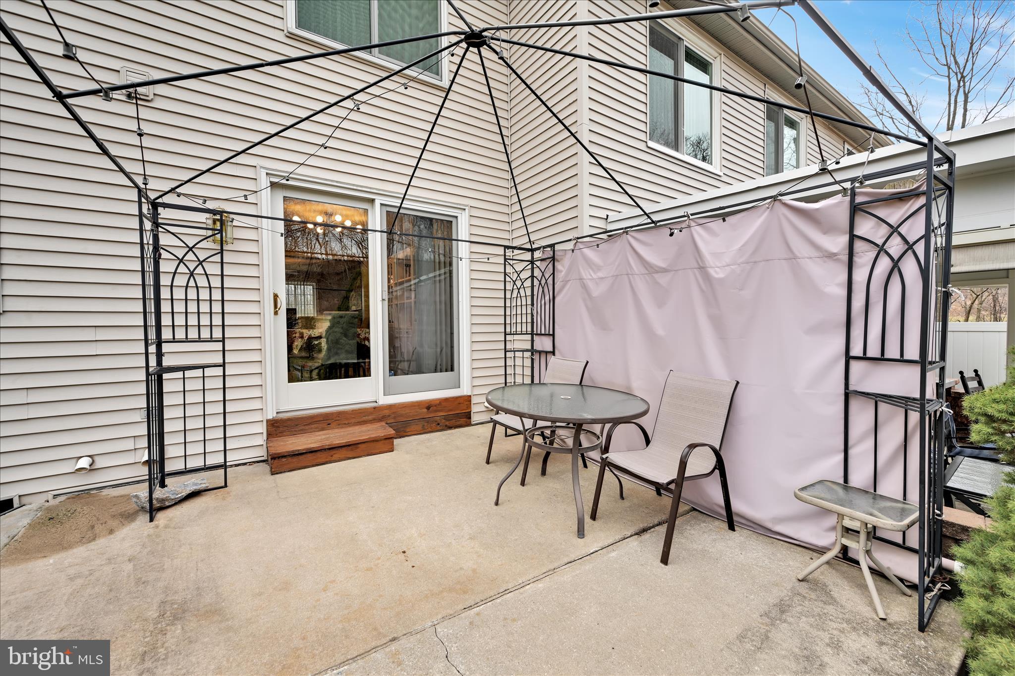 160 Riders Way Lebanon, PA 17042 - Photo 26 of 29 a view of patio with a table and chairs and wooden fence